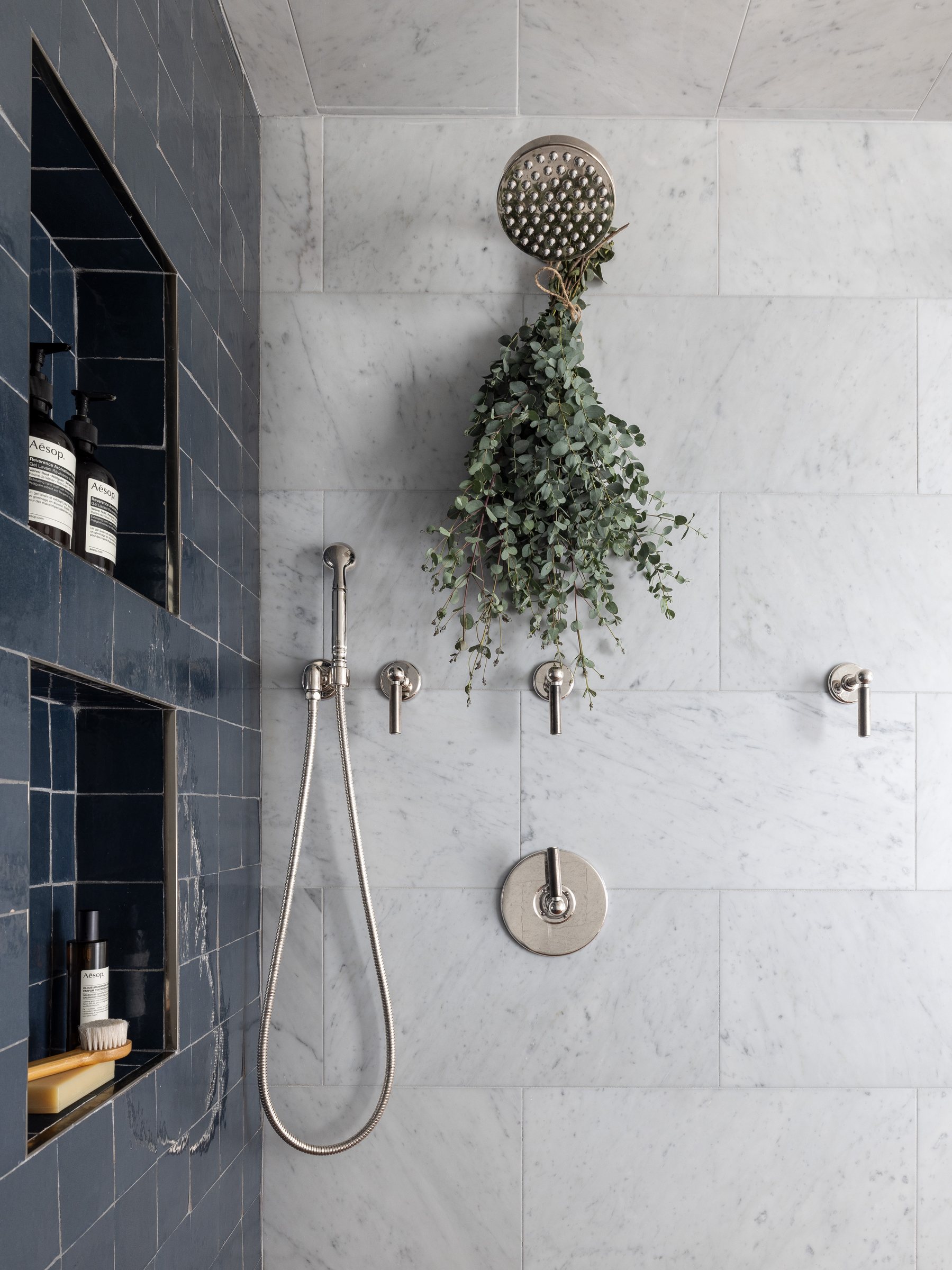 Marble shower with greenery, built by Mosher Dolan