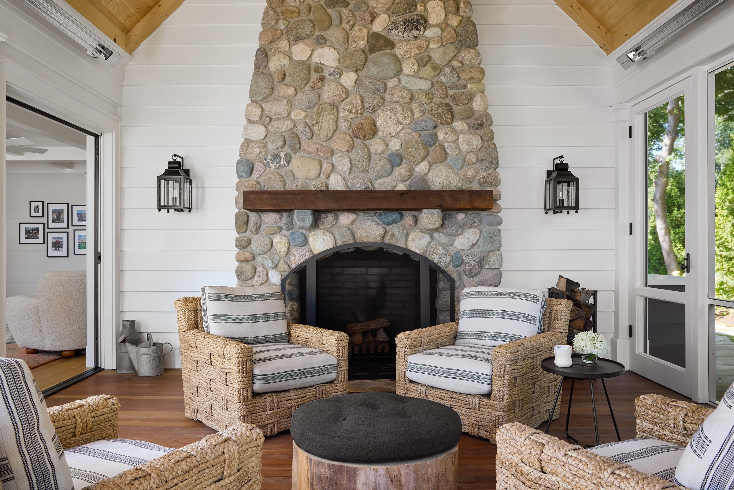 Covered porch overlooking the lawn and water