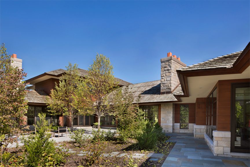 Stone and wood exterior detail at the Prairie Modern Estate