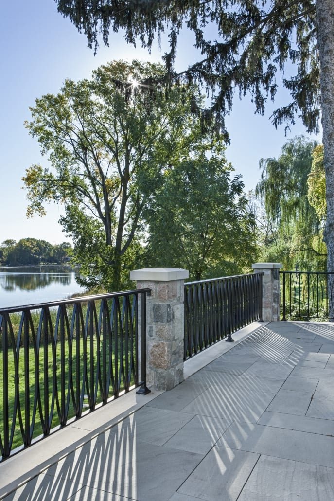 Iron railing and stone pier on the lakeside terrace