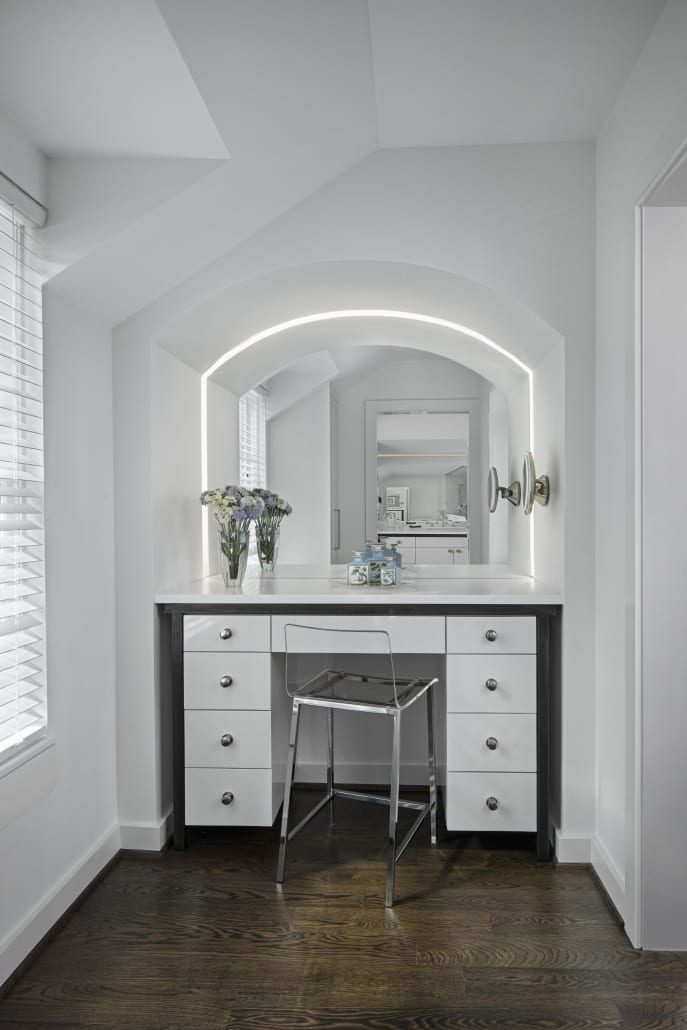Vanity alcove with a lit mirror